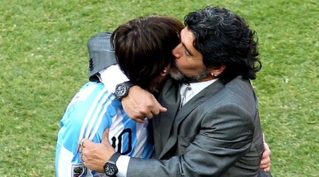 Maradona hugs Messi after their win against Korean Republic